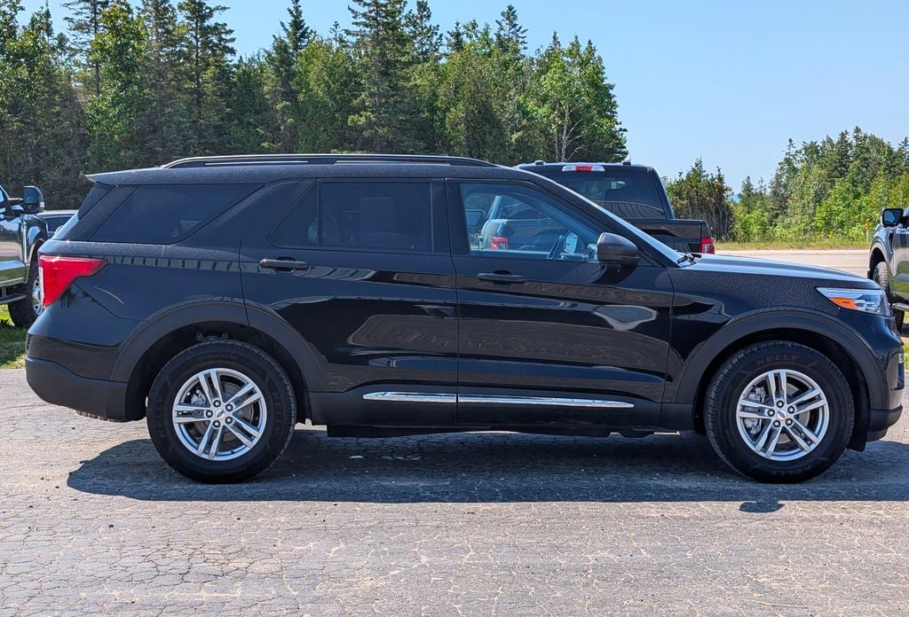 2023 Ford Explorer XLT in Black Metallic — front three-quarter view